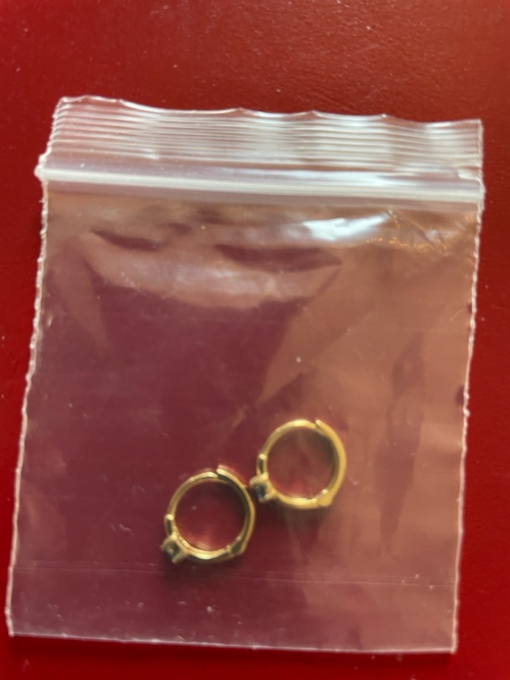 14kt gold huggie earrings.